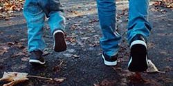 Parent and Child Walking on a Trail