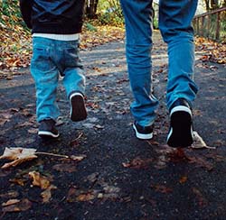 Parent and Child Walking on a Trail